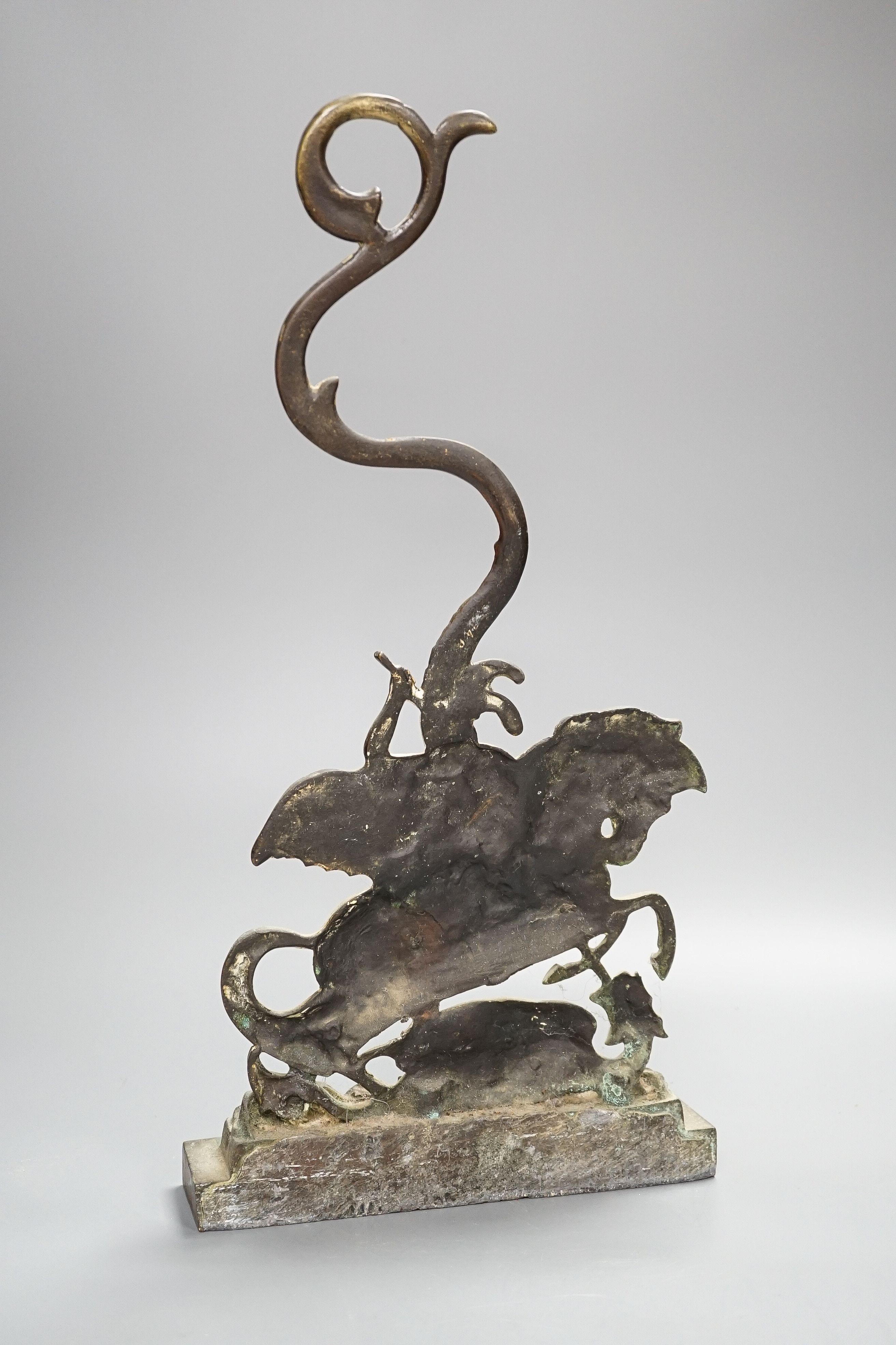 A brass door stop, St. George vanquishing the Dragon, height 40cm